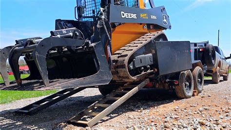 how to properly load a skid steer on a trailer|how to load a skid steer.